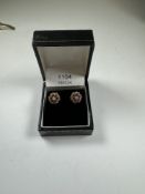 Pair of yellwo gold cluster earrings set with rubies and cz, 1cm diameter