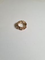 14ct yellow gold band ring of open floral design, seven small diamond chips, size K, marked 585, 4.5
