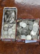 A tub of GB part silver six pence coins, 1920 - 1946 approx 520 grams and a small tub of silver and
