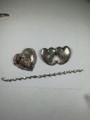 Large Sterling silver handmade brooch in the form of a heart with pprotruding female bust and revers