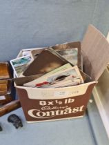 A small carton of mixed vintage postcards and others