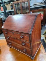 An apprentice piece writing bureau with turned wooden handles, on bun feet