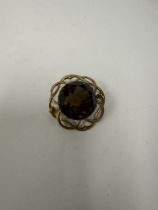 9ct yellow gold openwork circular brooch with large central smokey topaz, 3cm, marked 375, 10.9g