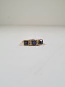 18ct yellow gold sapphire and diamond half hoop ring set central cushion cut blue sapphire flanked s