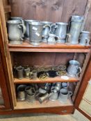 A quantity of Pewter tankards, horse brasses and similar