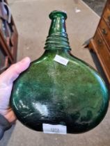 Two hand blown green bottles, possibly wine or port