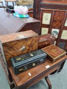 An antique cross banded tea caddy, a burr walnut decanter box and two other decorative boxes