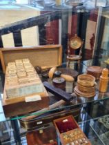 A selection of treen, including miniature chairs and a box containing various wood slices as referen