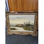 Daniel Sherrin- A landscape scene of Church and house beside water, signed, oil on canvas