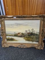 Daniel Sherrin- A landscape scene of Church and house beside water, signed, oil on canvas