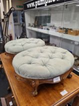 A pair of old oval footstools having buttoned top, on cabriole legs