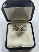 Silver and 14K gents ring with silver band and 14k gold X overlay, by D Yurman, size W, marked 925,