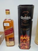 A vintage bottle of Johnnie Walker 1 Litre Scotch Whisky with red label and a modern bottle of Glenf