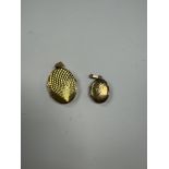 2 9ct yellow gold oval lockets, the largest 2.5cm, both marked 375, 7.8g