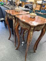 A pair of square French bedside tables, having gilt metal mounts, on cabriole legs