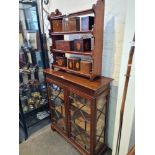 A glass fronted display cabinet with wooden effect inlaid glass "leaded" windows and marquetry