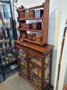 A glass fronted display cabinet with wooden effect inlaid glass "leaded" windows and marquetry