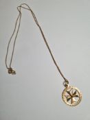 9ct yellow gold fine neckchain hung with a 9ct gold circular pendant with Maltese cross, both marked