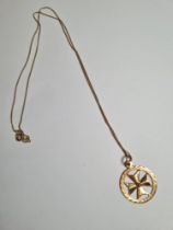 9ct yellow gold fine neckchain hung with a 9ct gold circular pendant with Maltese cross, both marked