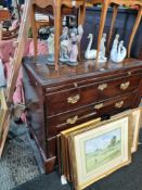 An antique mahogany chest having 3 long drawers with brushing slide, with later top
