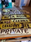 A selection of enamel signs, one saying "Private", "Lavatory - Men", etc
