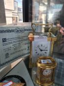 A good quality Mappin & Webb solid brass carriage clock and a small Halcyon Days miniature clock
