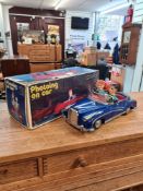 A vintage Chinese tinplate battery photoing car in original box No. ME630, with clean battery compar