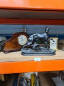 A Spelter sculpture of dog and bird, and 2 clocks