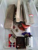A box containing Parker pens, Zippo lighters, medals and seals, etc