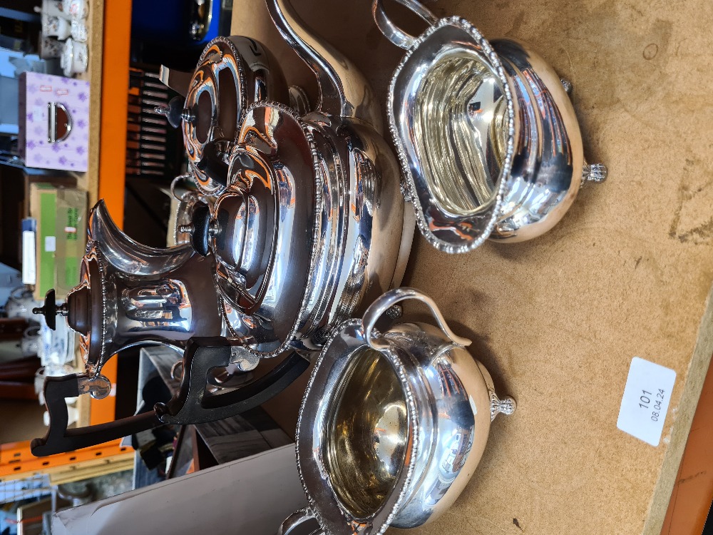 A Victorian style silver plated 3 piece tea set and one other 4 piece set