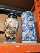 A blue and white oriental in style stick stand and a vase decorated with landscape scene