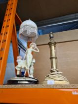 A brass heavy table lamp base plus a lamp adorned by a lady figure