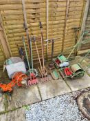 A selection of vintage gardening bygones, including hand mowers, shears, etc