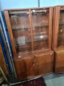 A 1980s Ercol display cabinet having glazed doors, with cupboard below, 91.5cms