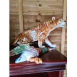 A ceramic tiger by Royal Dux, plus a ceramic wall duck