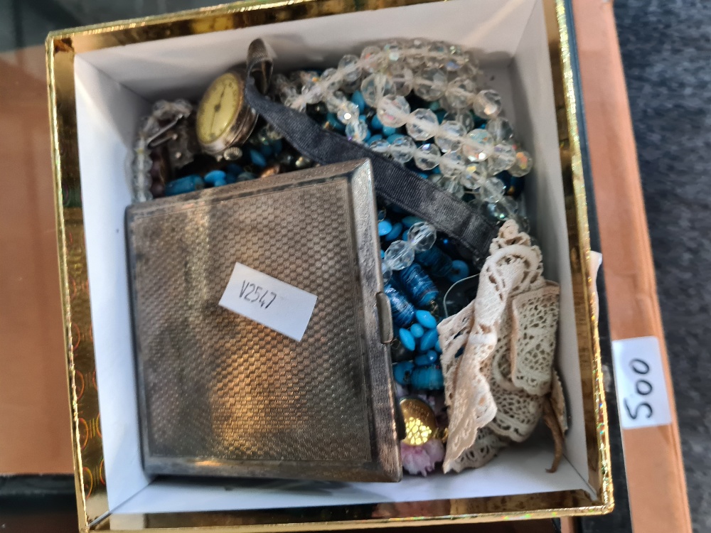 A box of costume jewellery including solid silver wristwatch and a top hat