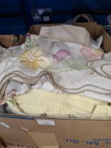 A mixed lot of vintage embroidered table cloths, etc