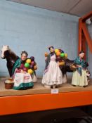 Three Royal Doulton figures of 'The Orange Lady', 'Biddy Penny Farthing' and 'The Old Balloon Seller