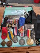 A Military lot to include modern buttons, badges, replica medals and similar