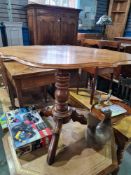 An antique French Walnut tripod table having shaped top on turned pillar, 100cm