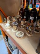 A quantity of Hummel figures and 3 small plates
