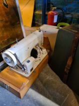 A Frister and Rossman vintage sewing machine and a Reel to Reel player