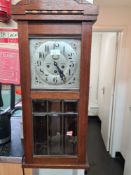 An early 20th century walnut cased wall clock