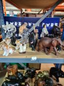 A selection of animal figures including wooden elephants, china tigers and birds