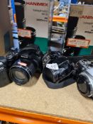 A varied selection of vintage cameras including Olympus, Nikon, Sony, etc and Hamimex lenses