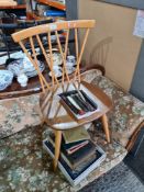 A vintage Ercol chair having criss cross back
