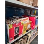 A shelf of mixed vinyl records, various decades, LP, 7 inch and 12 inch examples