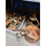 A selection of brass and copperware, including saucepans, bell weights, horse brasses, etc