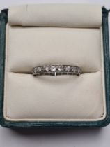 Unmarked white gold full Eternity ring inset brilliant cut diamonds, size Q, approx 3g