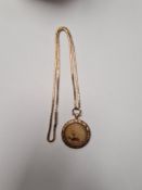 Unmarked yellow metal chain, probably 9ct gold, AF, broken link, hung with a circular pendant, locke